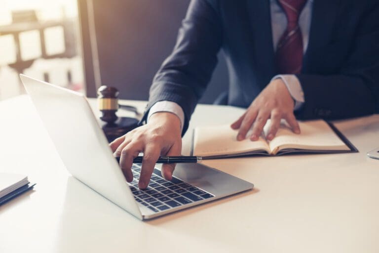 A person using their laptop.