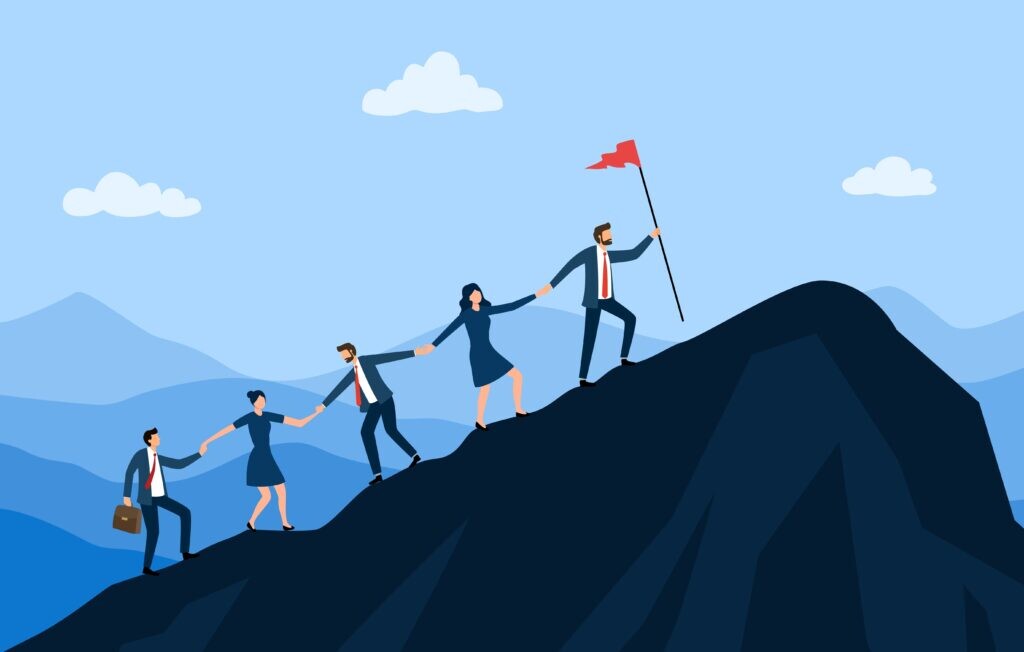 Five cartoon figures holding hands walking uphill